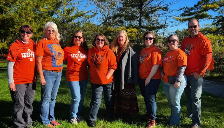 a group of volunteers stand together