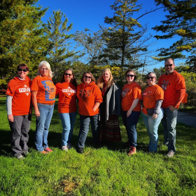 a group of volunteers stand together
