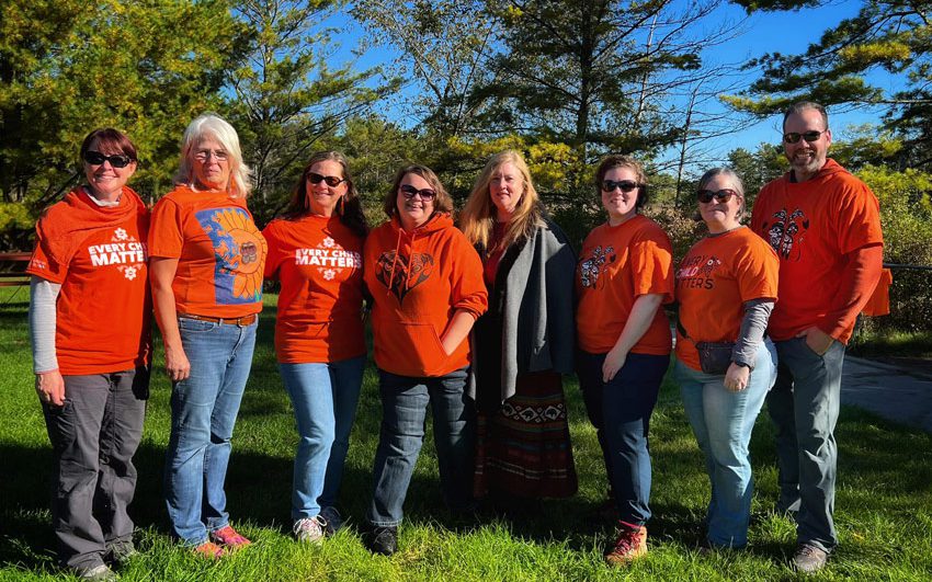 a group of volunteers stand together