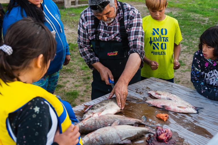 montreal lake trip cutting fish in front of students in saskatchewan