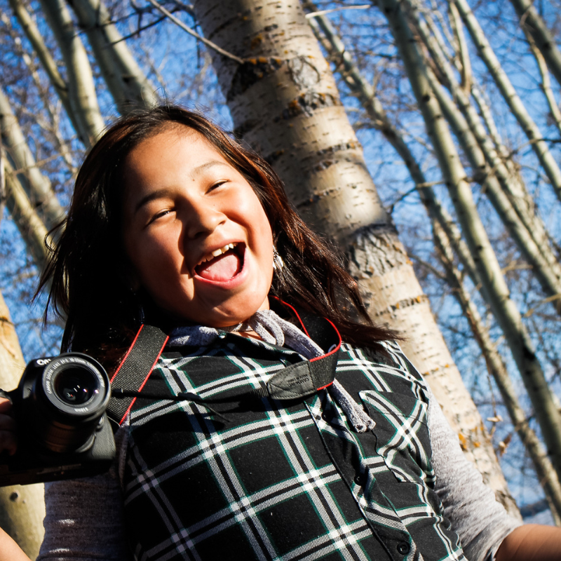 girl with camera in northern Ontario first Nation Eabametoong