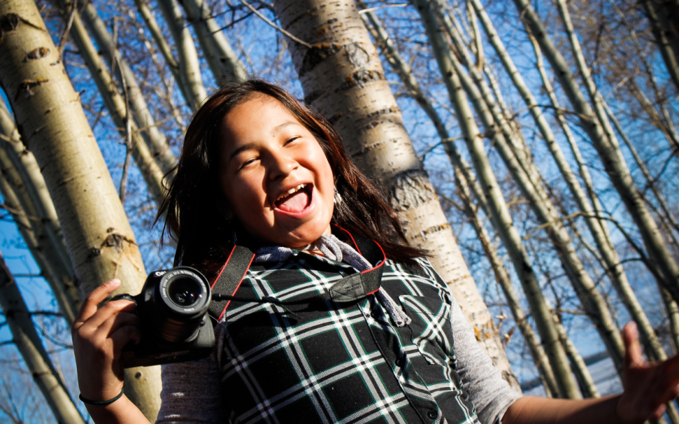 girl with camera in northern Ontario first Nation Eabametoong
