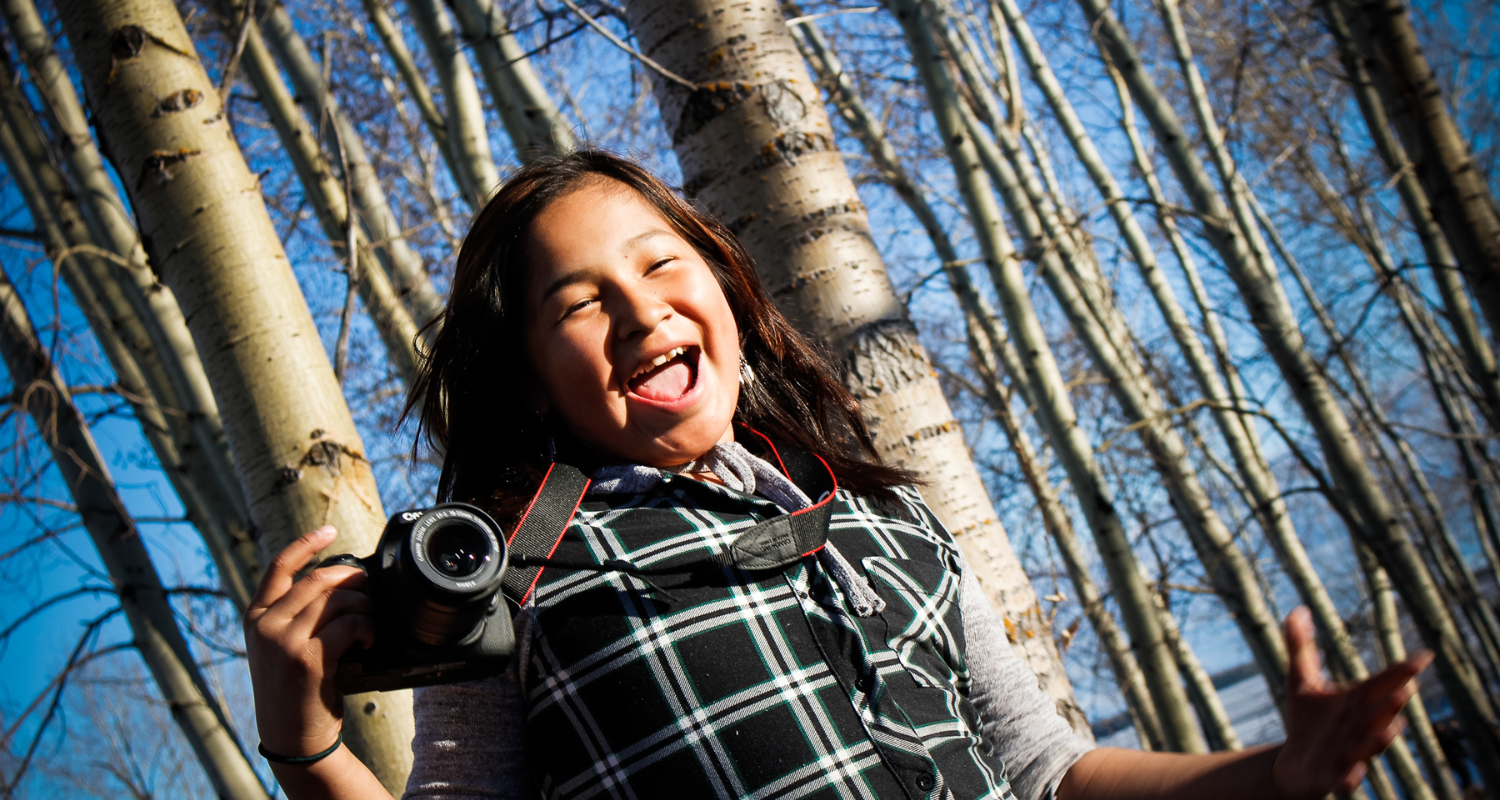 girl with camera in northern Ontario first Nation Eabametoong