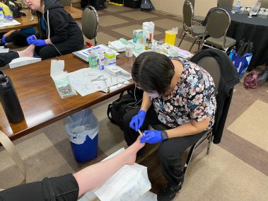 Nurse looking at a patients foot